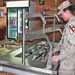 Spc. Deanna Mistler prepares the salad serving line