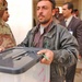 Elections: Iraq employees transport election ballot