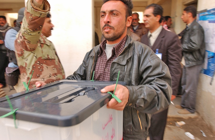 Elections: Iraq employees transport election ballot