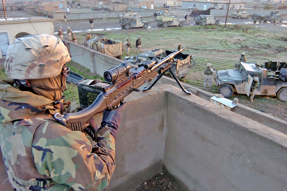 Spc. Thomas Golden mans a M240B machine gun