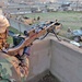 Spc. Thomas Golden mans a M240B machine gun