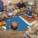Soldiers listen to the muqtar of Sudayera during a meeting