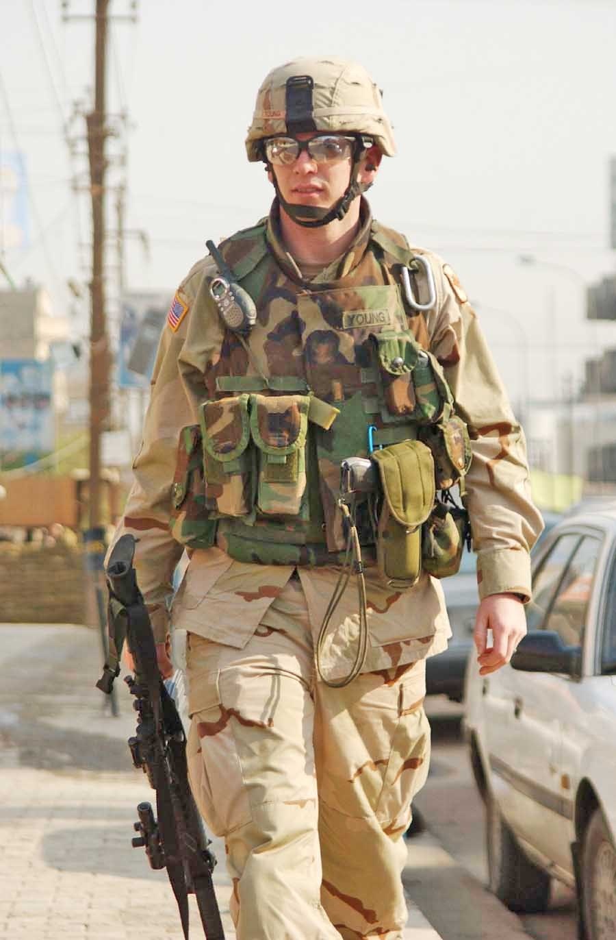 2nd Lt. Adam Young walks down the city streets