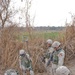 Spc. Nathan Woodruff digs for hidden weapons caches
