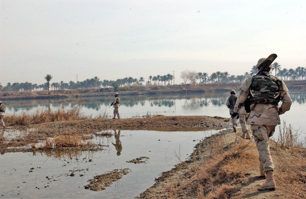 Scouts sweep an area along the Euphrates River