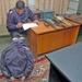 An Iraqi Police officer questions a suspected terrorist