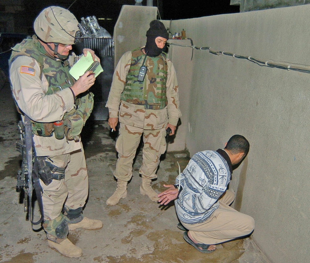 Capt. William Hampton questions a detainee