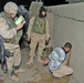 Capt. William Hampton questions a detainee