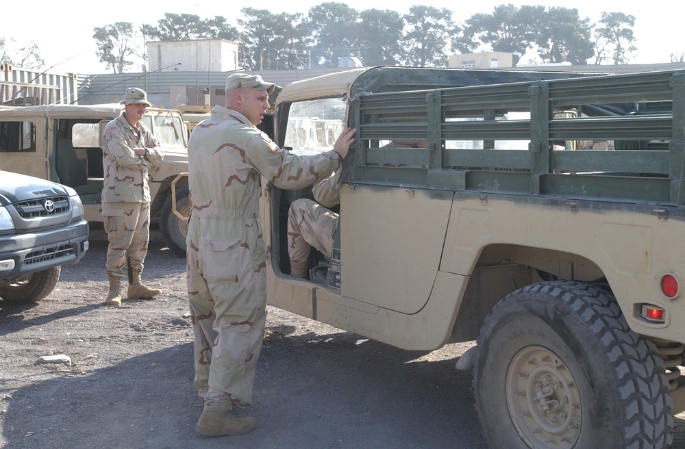 Sgt. John Fox talks to Spc. Kent Nelson