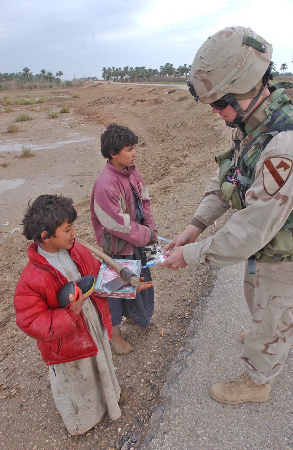 Sgt. Sidney Park distributes toothbrushes and toothpaste
