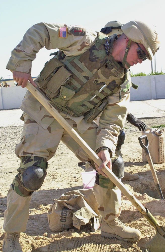 SSgt Edwin Pere works on the construction of playground system