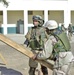 Soldiers installs steps for a playground system