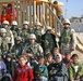 Soldiers pose in front of playground system