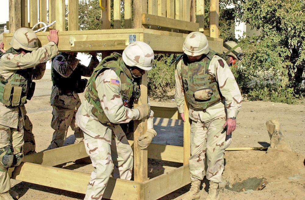 Soldiers carry the main part of playground to put in place