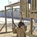 One of the over 220 girls plays on a recently built playground
