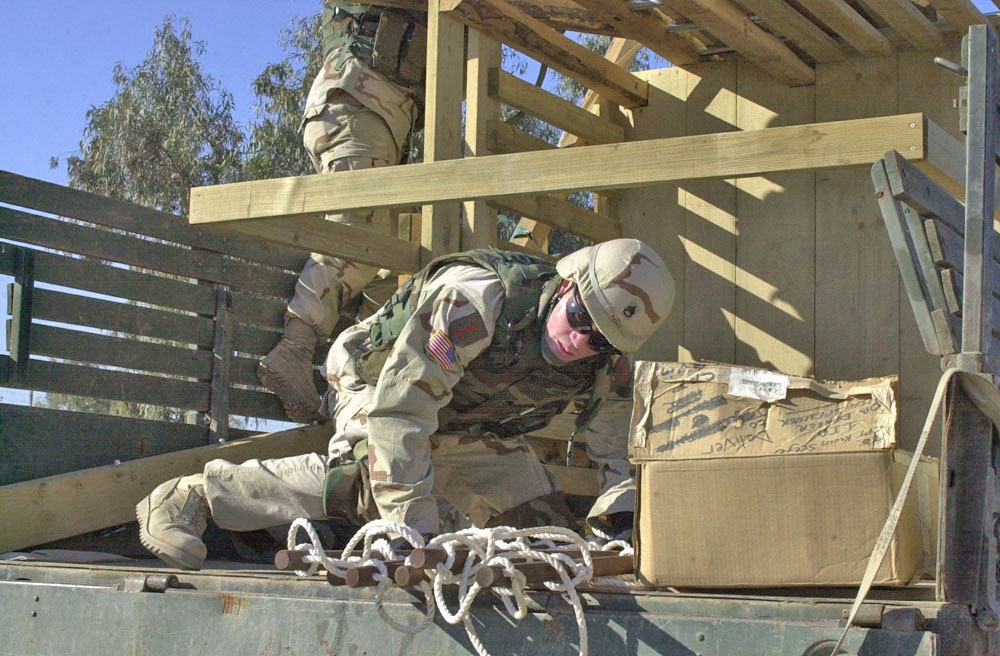 SSgt Edwin Perez unloads the equipment for the playground