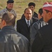 An Iraqi national talks with members of the Iraqi National Guard