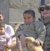 Sgt.Thomas poses for a picture with an Iraqi family