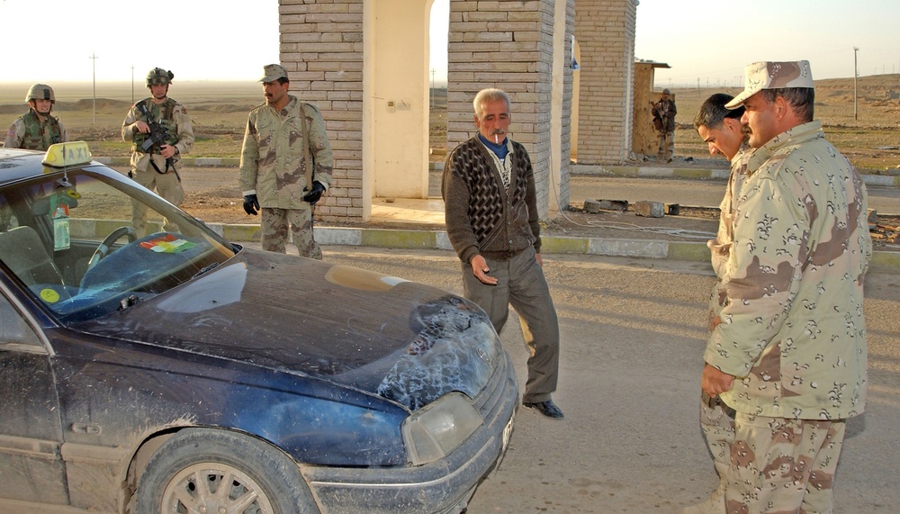The Iraqi National Guard perform vehicle searches