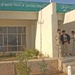 Iraqi National Guardsmen stand outside the Police Headquarters