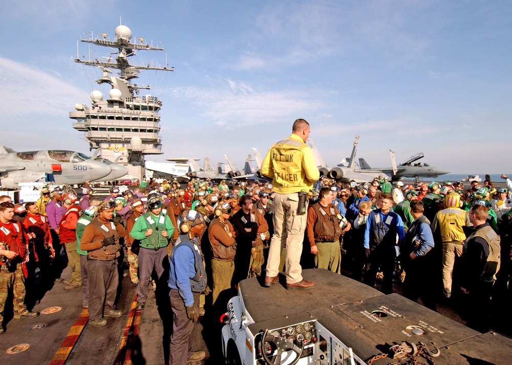 Lt. Larry Spradlin stands surrounded by personnel