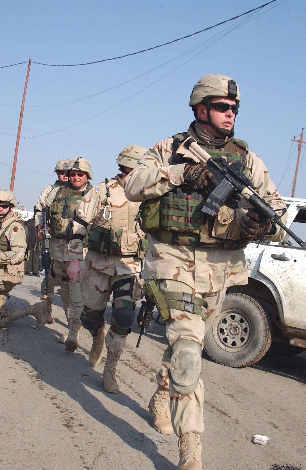 Sgt. Krogmann leads soldiers towards the site