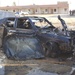 An Iraqi police vehicle damaged by shrapnel