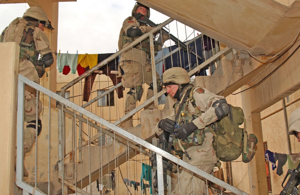 Spc. Patton moves with his fellow Soldiers