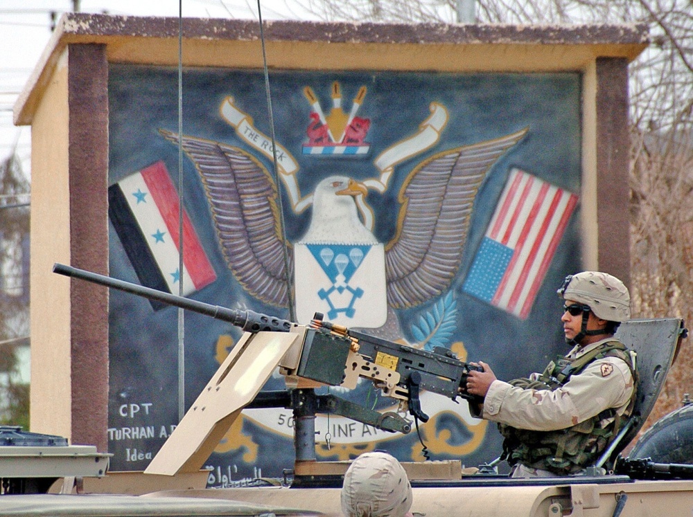 Sgt. Jamal Kennedy mans a .50 caliber machine gun