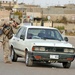 Spc. Anthony Authier prepares to search a vehicle