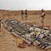 Soldiers take a look at some of the munitions found