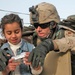 Spc. Thomas Dulinsky and girl Sit on Top of His Humvee