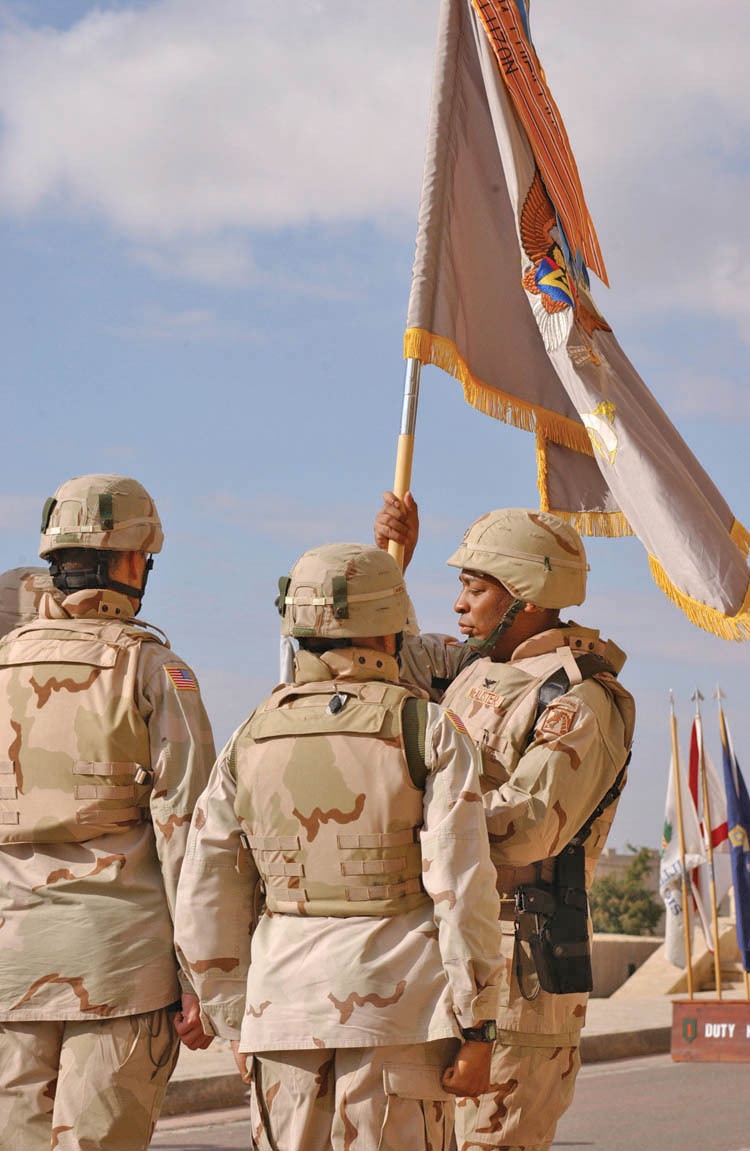 Col. Mark A. McAlister takes the Battalion colors