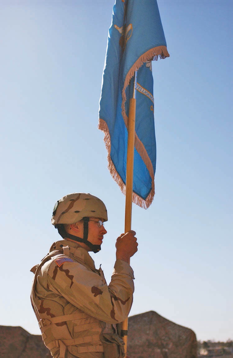 A Soldier carries the units colors