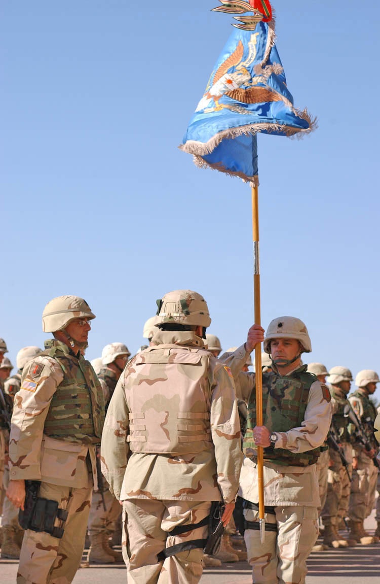 Lt. Col. Frank Hall holds his unit colors