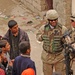 Sgt. 1st Class Reid speaks with a group of residents
