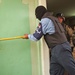 Spc. Montiel supervises as an Iraqi policeman