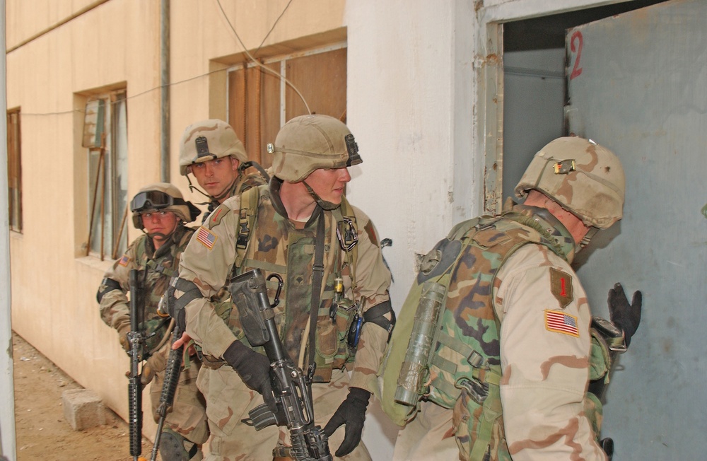 Soldiers prepare to move into an apartment