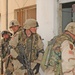 Soldiers prepare to move into an apartment