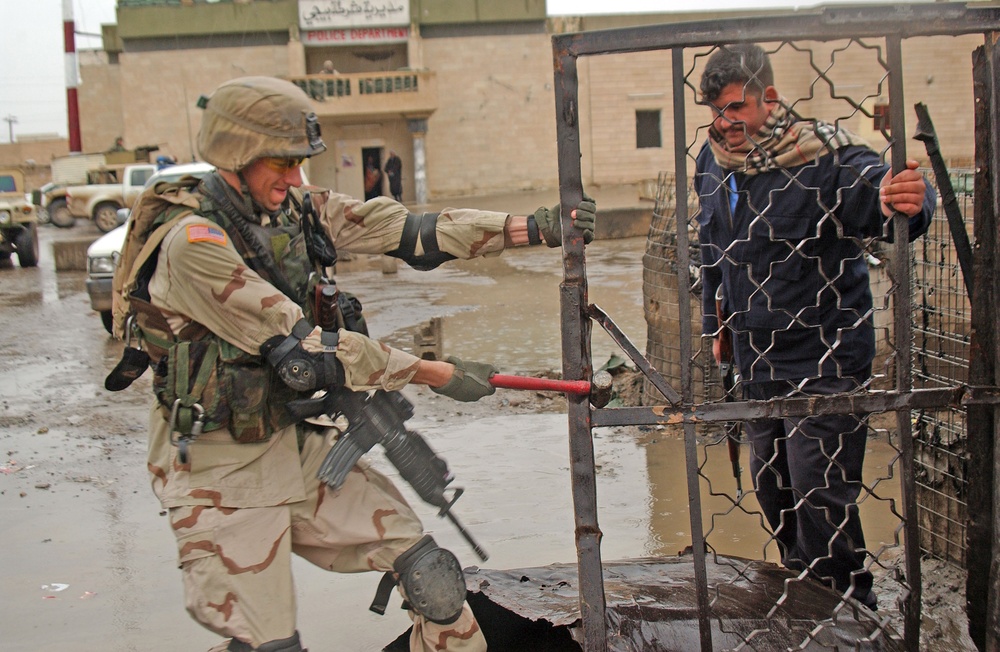 1st Lt. Walter test the gate at the police station