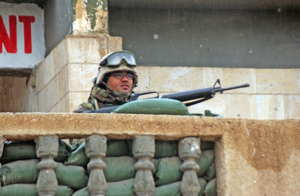 Spc. Velez keeps watch for any suspicious activity