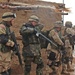 Soldiers prepare to move into the home