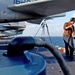 Airman Tuia J. Mikaele cleans the deck