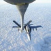 An F/A-18C Hornet refuels with a Air Force Tanker