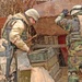 Two soldiers search ammunition boxes found