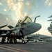 Sailors performs maintenance on an EA-6B Prowler