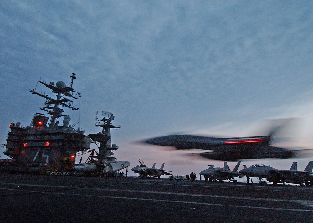 An F/A-18C makes an arrested landing on the flight deck