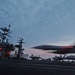 An F/A-18C makes an arrested landing on the flight deck