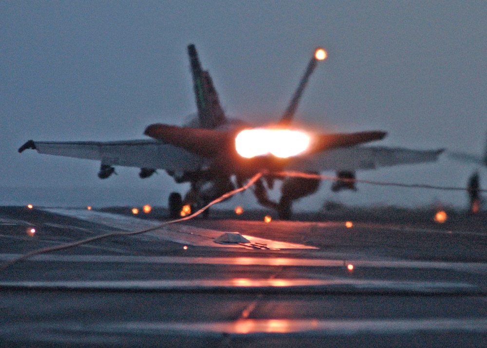 An F/A-18 Hornet makes an arrested landing