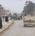 A U.S. Army convoy rolls through the city of Balad